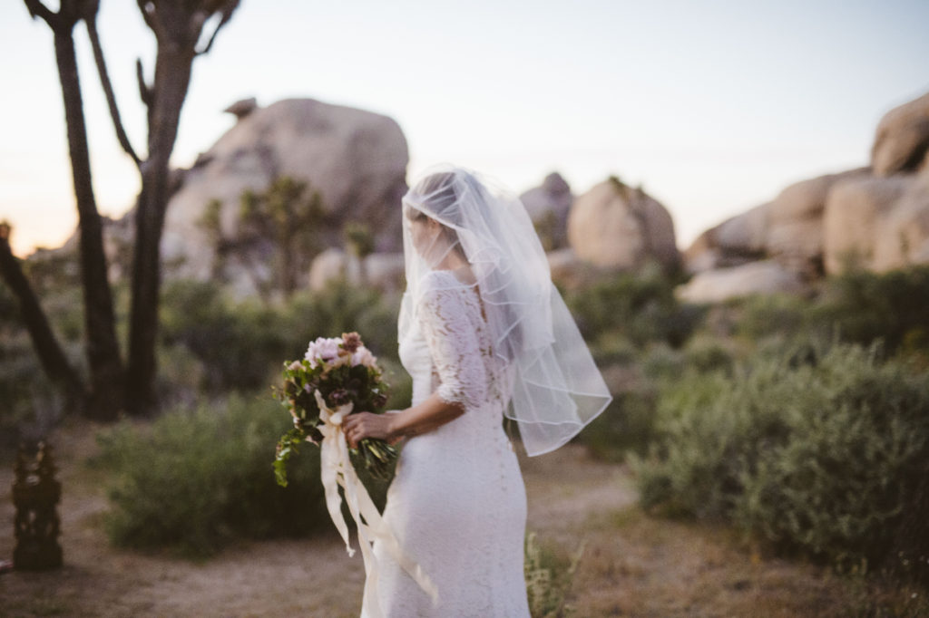 bride on her way to Joshua tree national park elopement