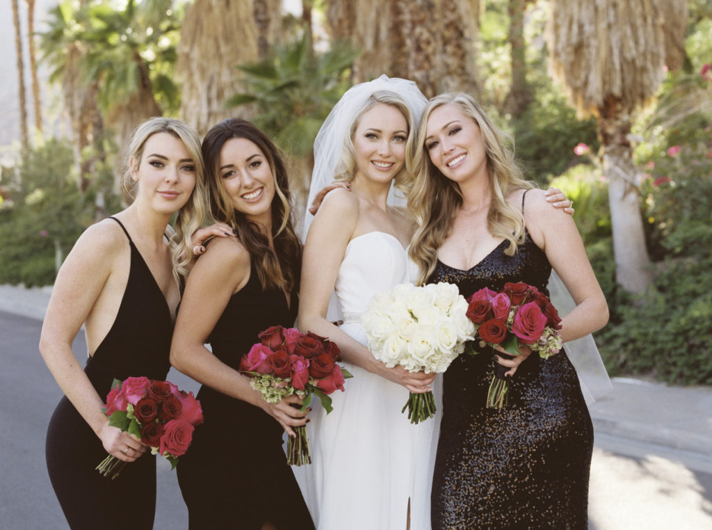 Portrait of bride and her bridesmaids in the streets of Palm Springs, California
