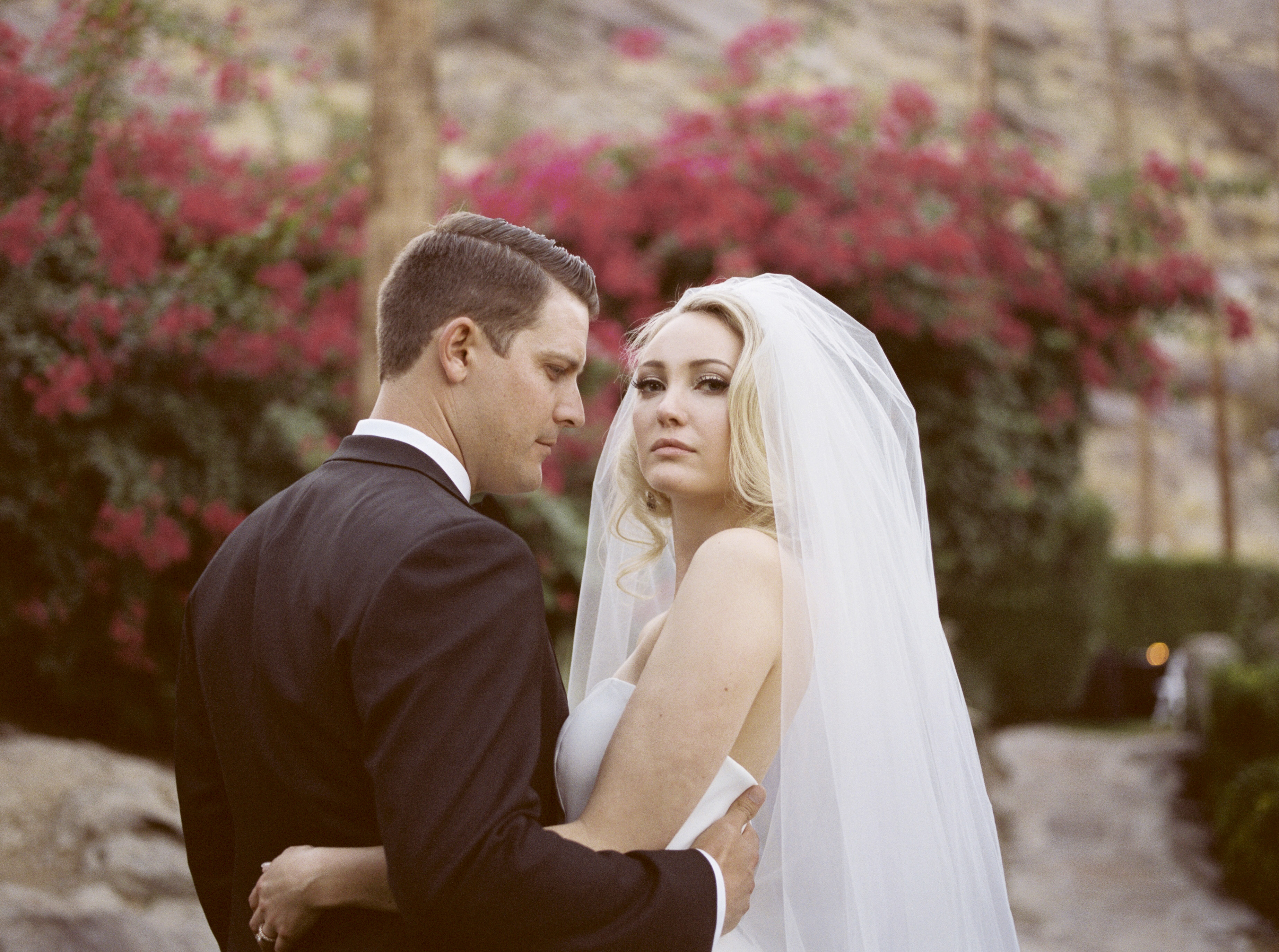 portrait of bride and groom on their wedding day in palm springs california