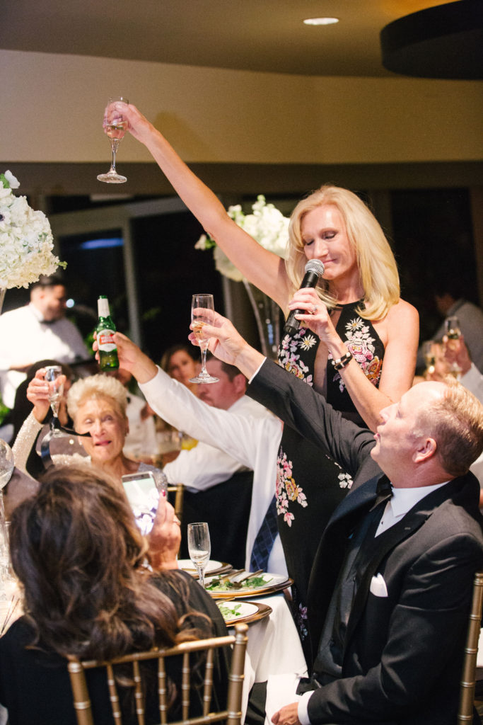 mother of the groom has a celebratory toast with friends and family