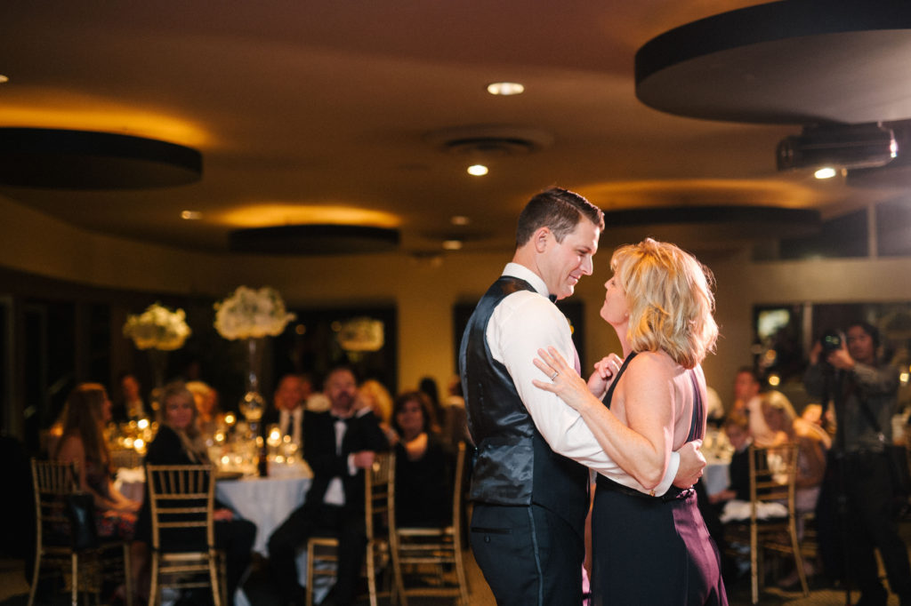 Groom and his mother enjoying their mother and son dance during his wedding reception