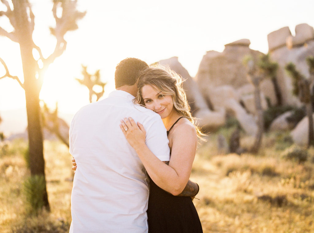 film photo of bride and groom hugging for their joshua tree engagement photo