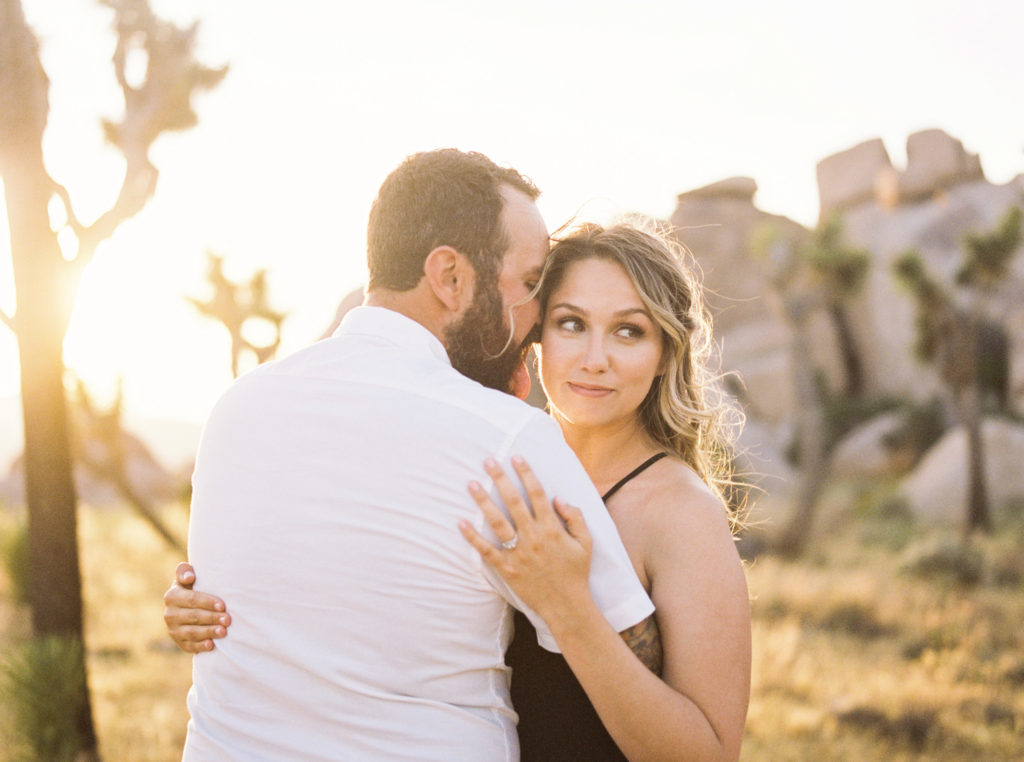 groom sticking his tonue out during Joshua Tree engagement, shot in film