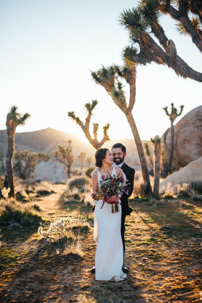 Bride and groom embrace in the desert, featured within our Micro Wedding Ideas article by Mathew David studio
